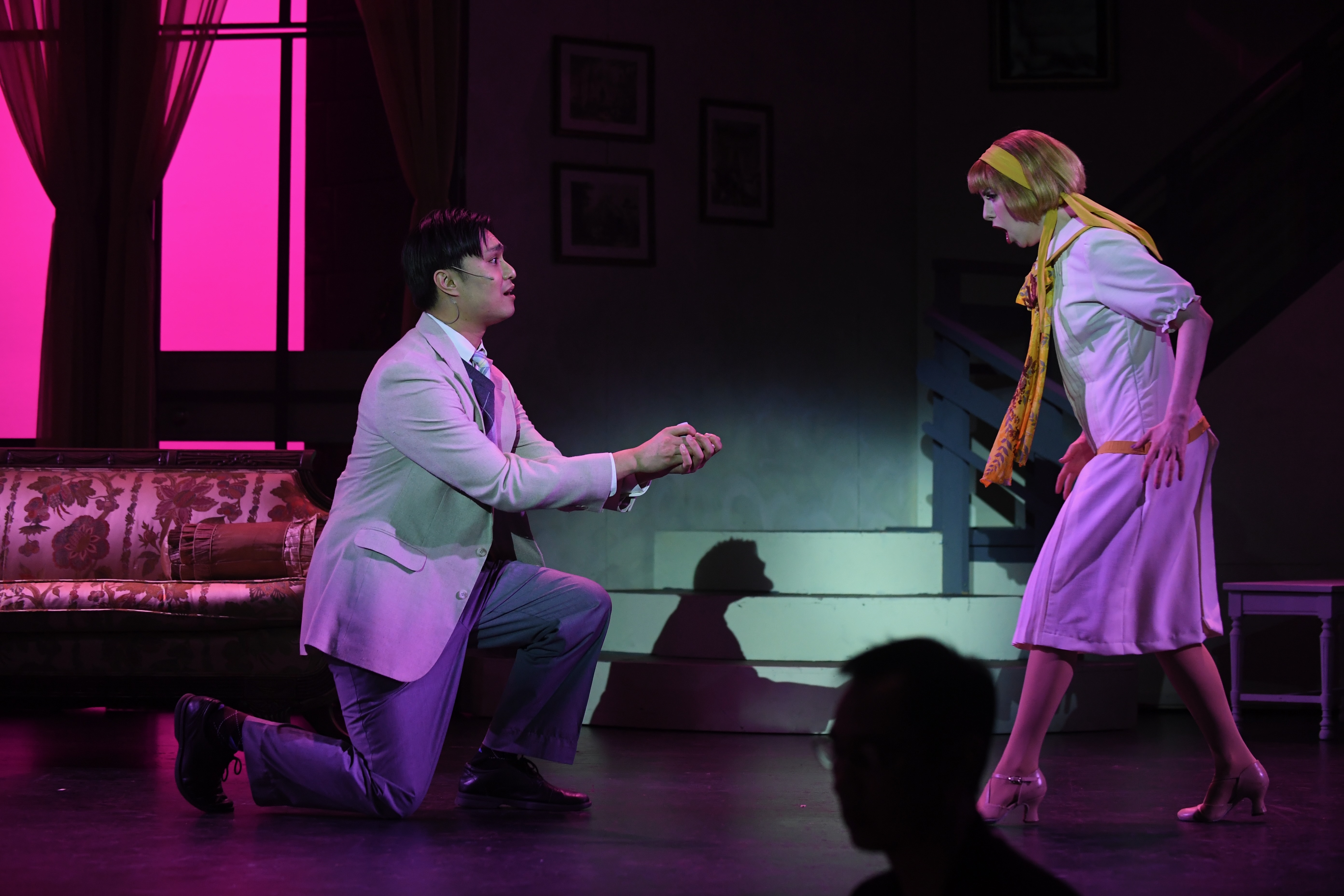 a couple picks heather on a hill